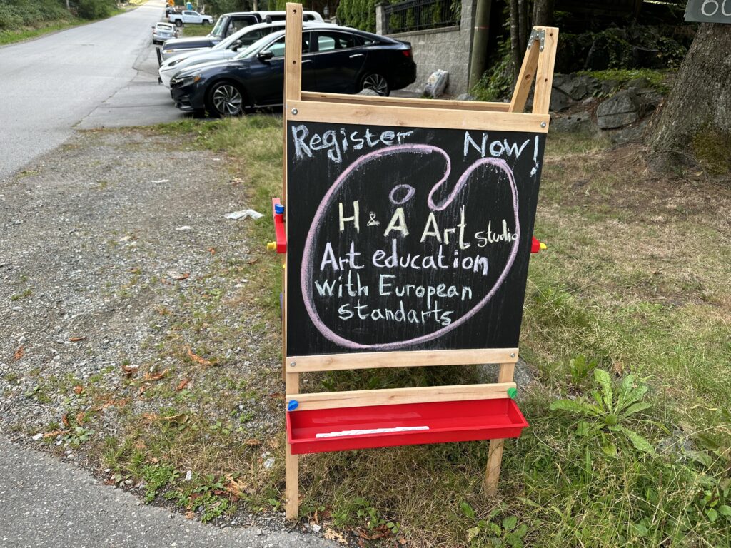 A blackboard sign for an art studio providing "Art education with European standards"