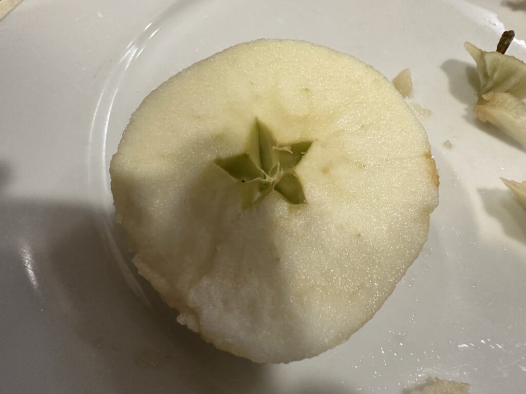 An apple with the core looking like a five-point star
