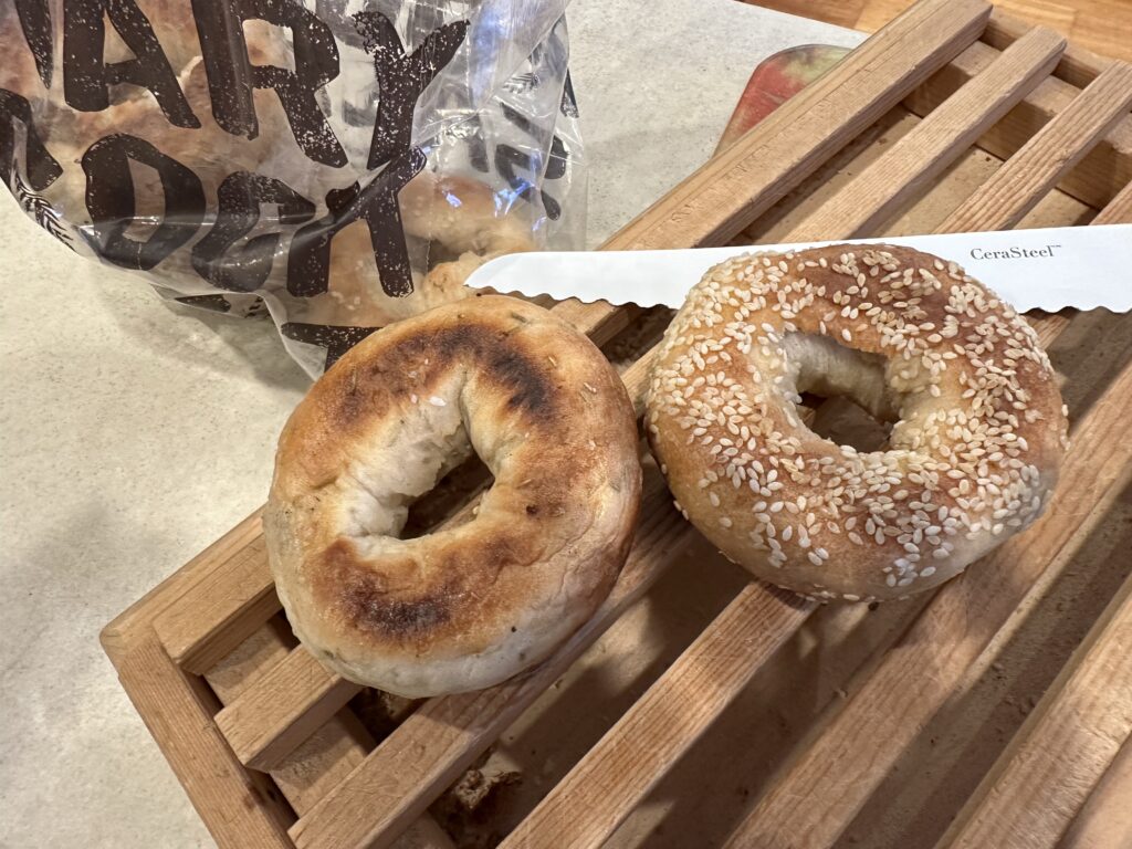 A signature rosemay & rock salt bagel, and a classic sesame seed bagel. Both Montreal-style bagels, of course.