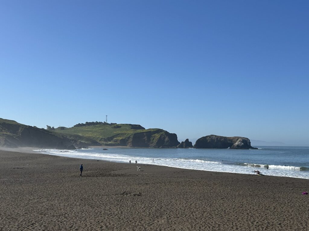 Rodeo Beach near San Francisco, CA. A few surfers and dog walkers were there enjoying the waves.