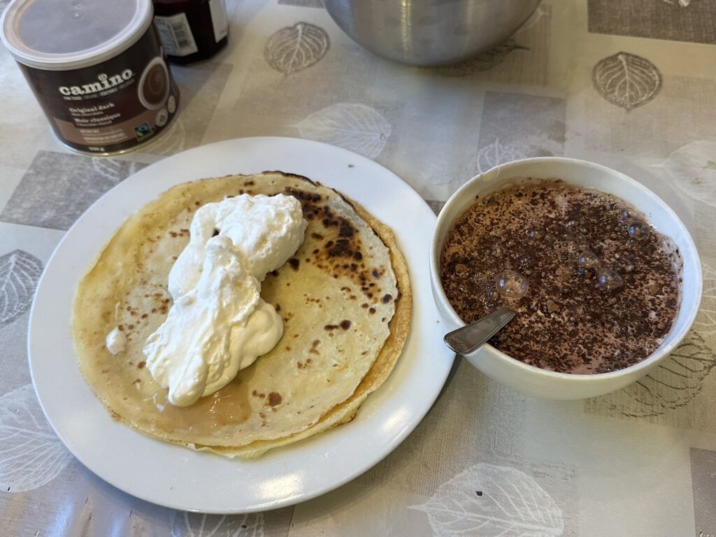 For what it's worth, the hot chocolate is Camino's "Original Dark" which I mix with some pure cocoa to make it darker and less sweet.  The crepes and the whipped cream I did last night for dinner.