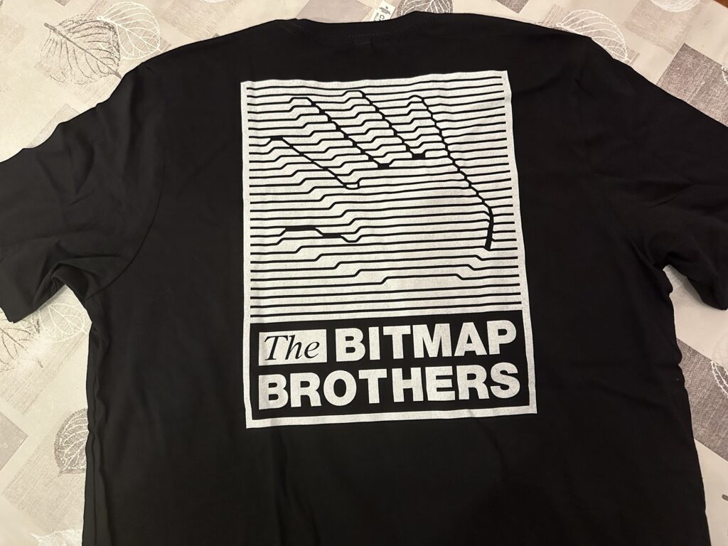 A black t-shirt with a big-ass version o the Bitmap Brothers logo in the back. Not pictured: the front has a small version of the logo over the wearer's heart.