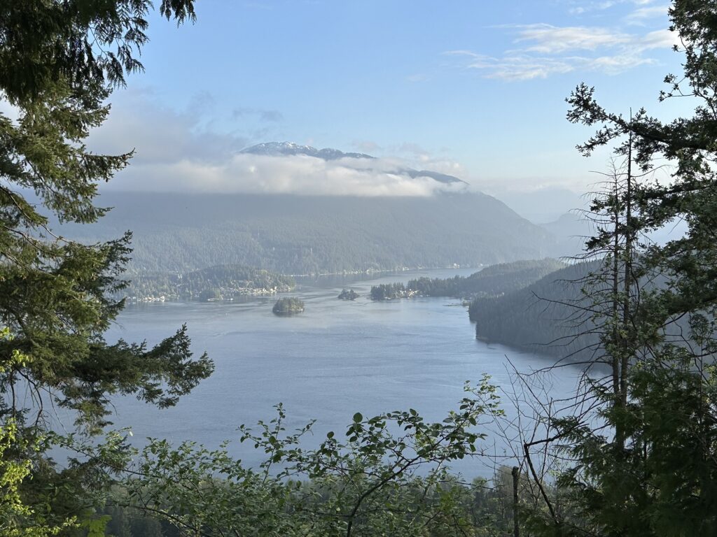 A view from the top of Burnaby Mountain, where we see the north shore mountains, the inlet, and a few islands.