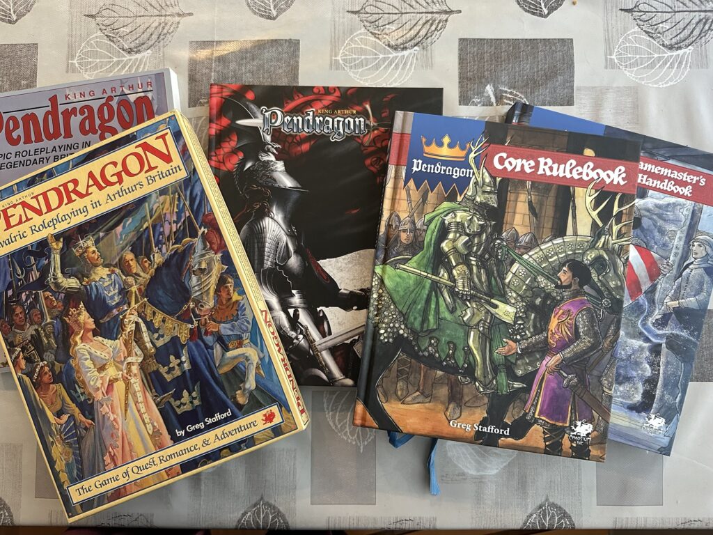 The first, 3rd, 5th, and 6th editions of Pendragon.