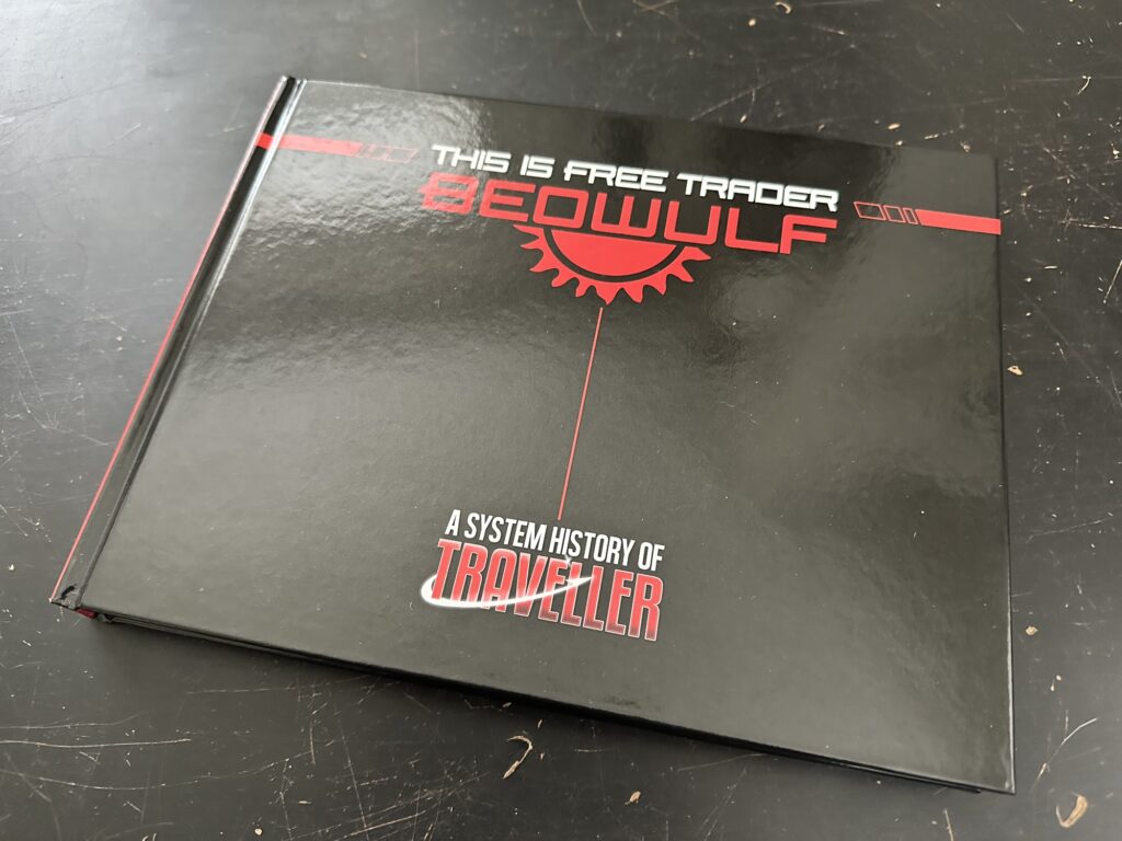 The coffee-table-sized "This is Free Trader Beowulf", described as "A System History of Traveller". It talks about the history of the game, the people behind it, the various publications, editions, publishers, and more.