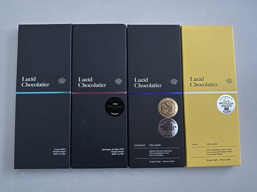 Four bars of "Lucid Chocolatier" bars, courtesy of Origins Chocolate in New Westminster.