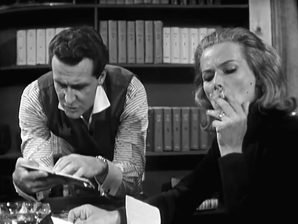 Steed and Gale are looking at some stamps or something.