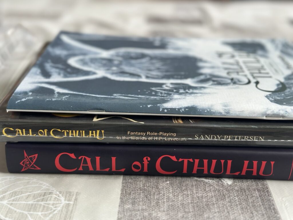 A stack of Call of Cthulhu rulebooks.