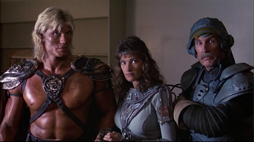 He-Man, Teela, and Man-at-Arms. Nobody really looks like their original characters, but at least I got a chuckle at Chelsea Field looking dead at the camera after shooting a couple bad guys and saying "woman at arms!"