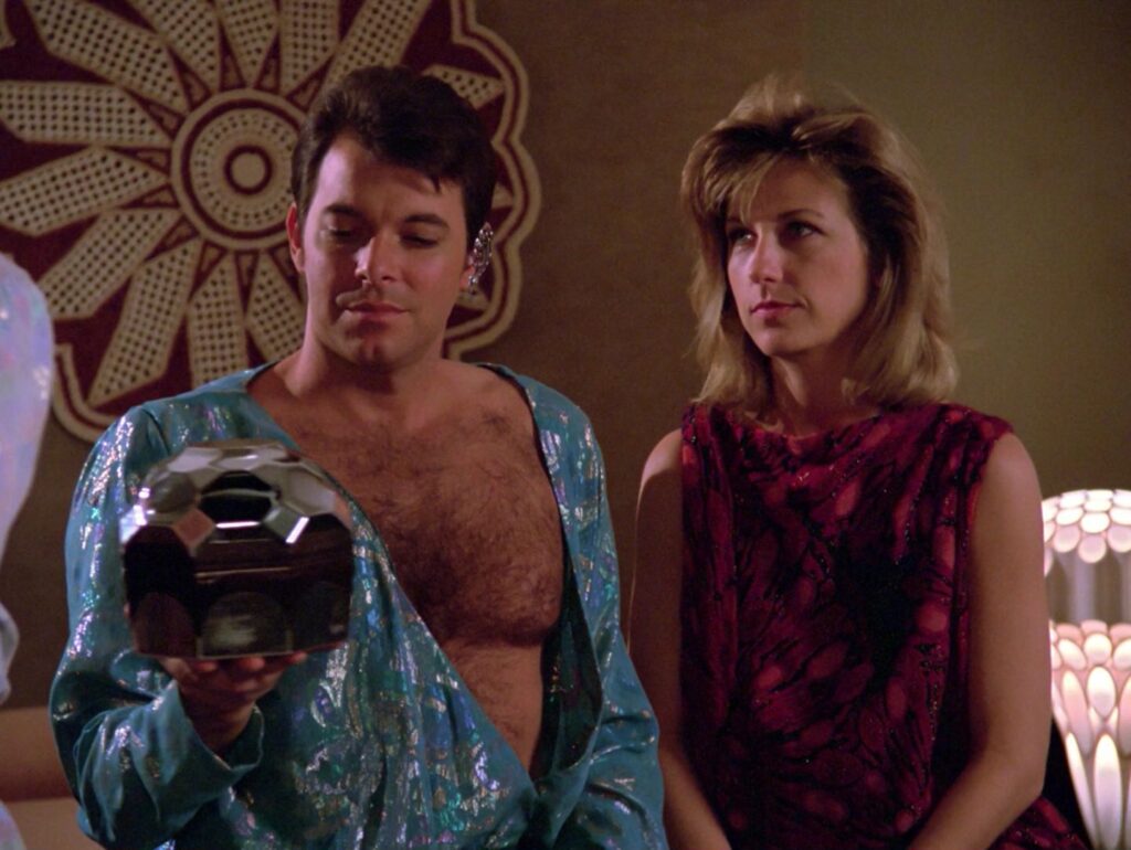 Riker is looking super sexy when Beata, leader of the planet Angel One, summons him to her bedroom for, ahem, diplomatic reasons. This whole episode was ridiculously cheesy fun.