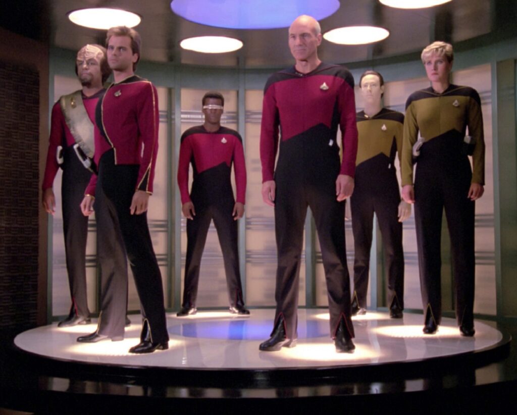 A whole bunch of people from the Enterprise crew are ready to beam out.