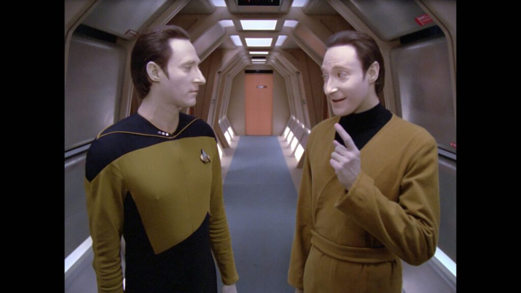 Data and evil-Data are chatting in a corridor in the Enterprise.