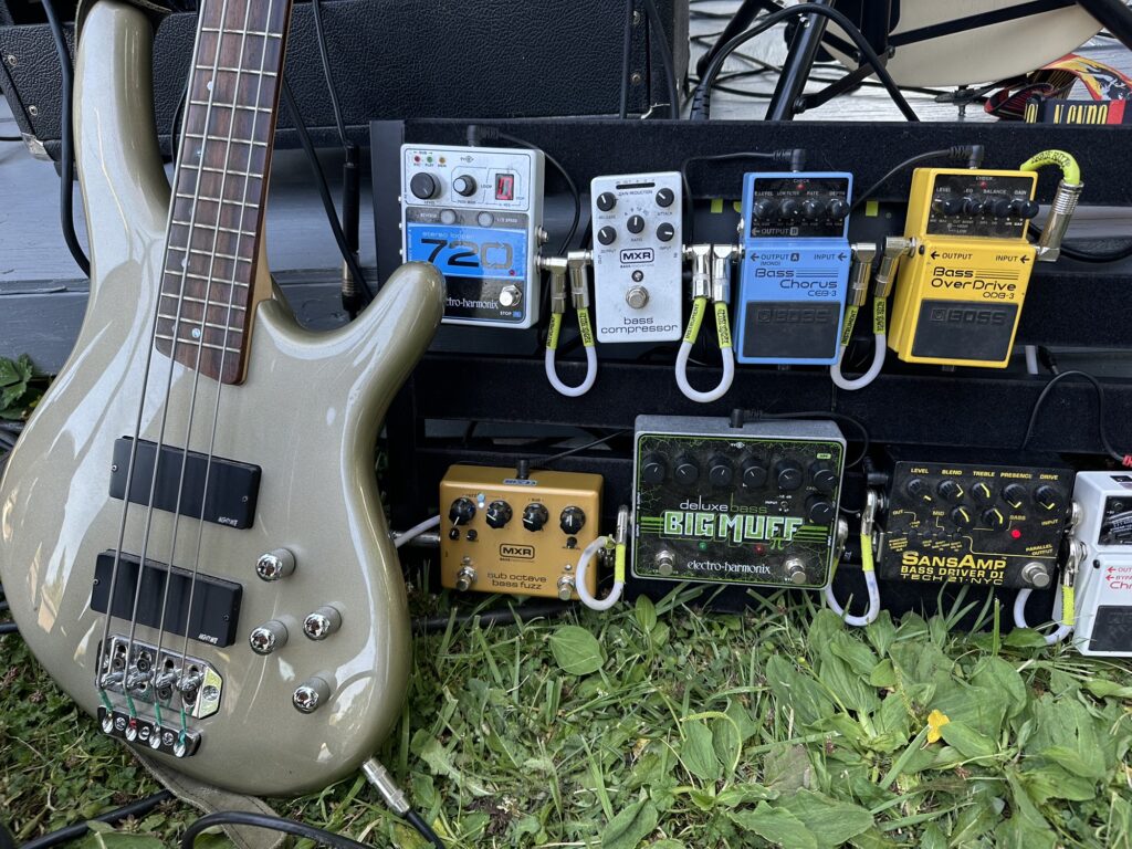 A bass guitar and some effect pedals
