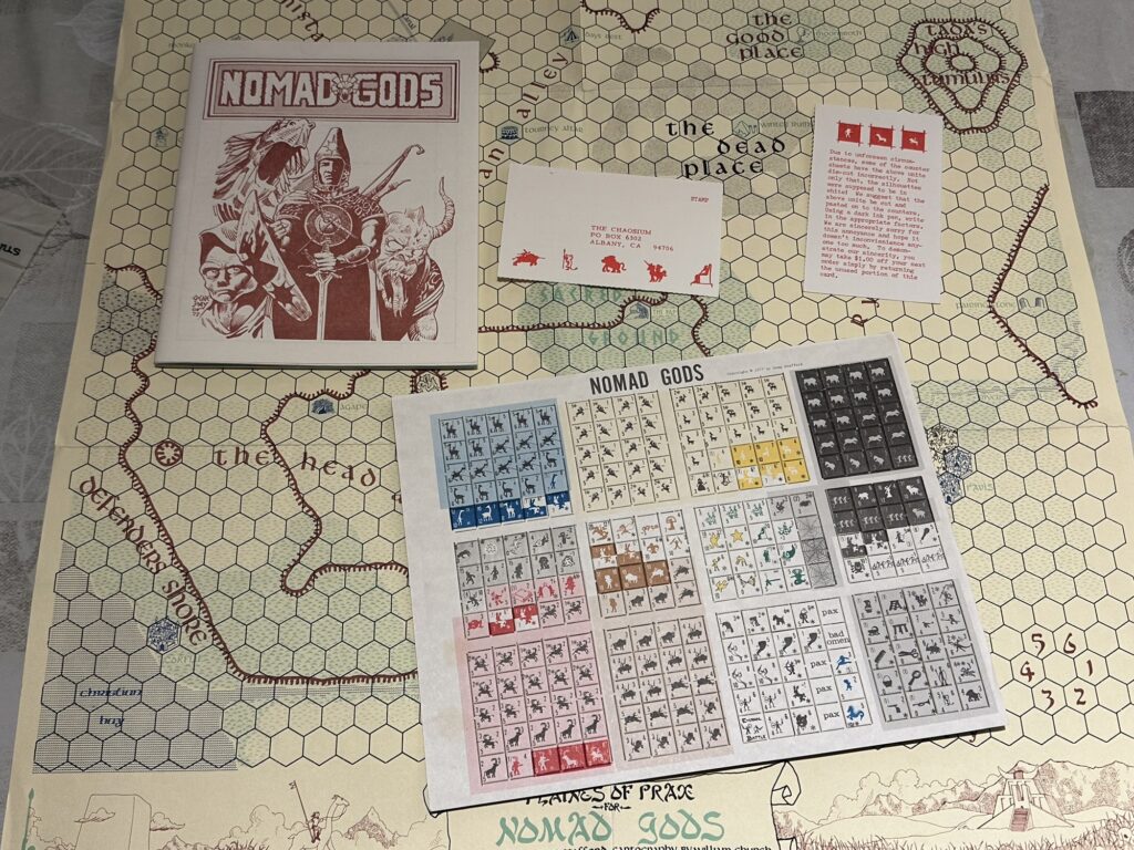 The Nomad Gods board map, rulebook, unpunched chits sheet, and a few extra bits.